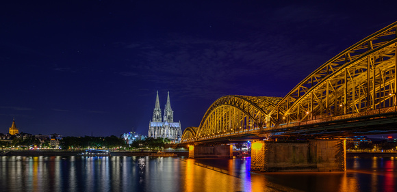 Cologne Cathedral and Hohenzollern Bridge over the Rhine River