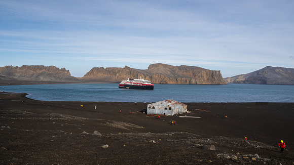 MS Roald Amundsen and remains of Whaling Processing Building on Deception Island